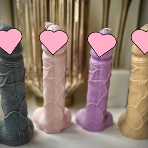 A small male genitalia soy wax candle.